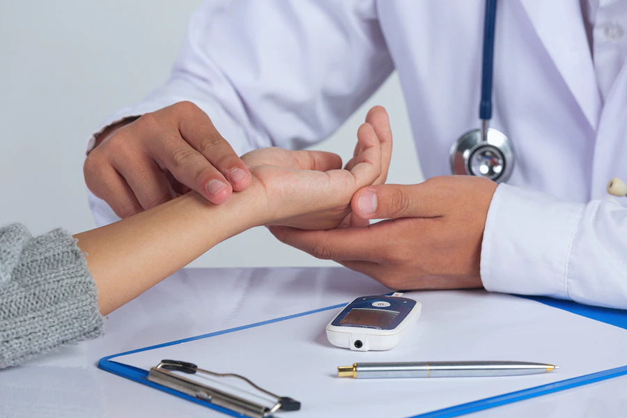 diabetes doctor checking patient pulse